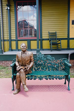 Statue of Tennessee Williams in front of Tennessee Williams home and welcome center downtown columbus
